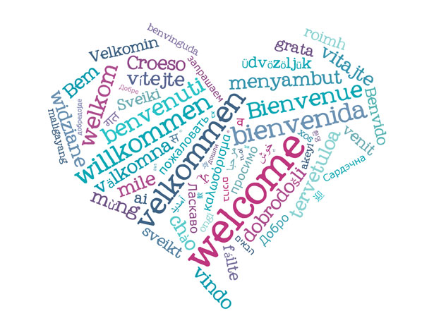 Heart made of the word welcome written in many languages.