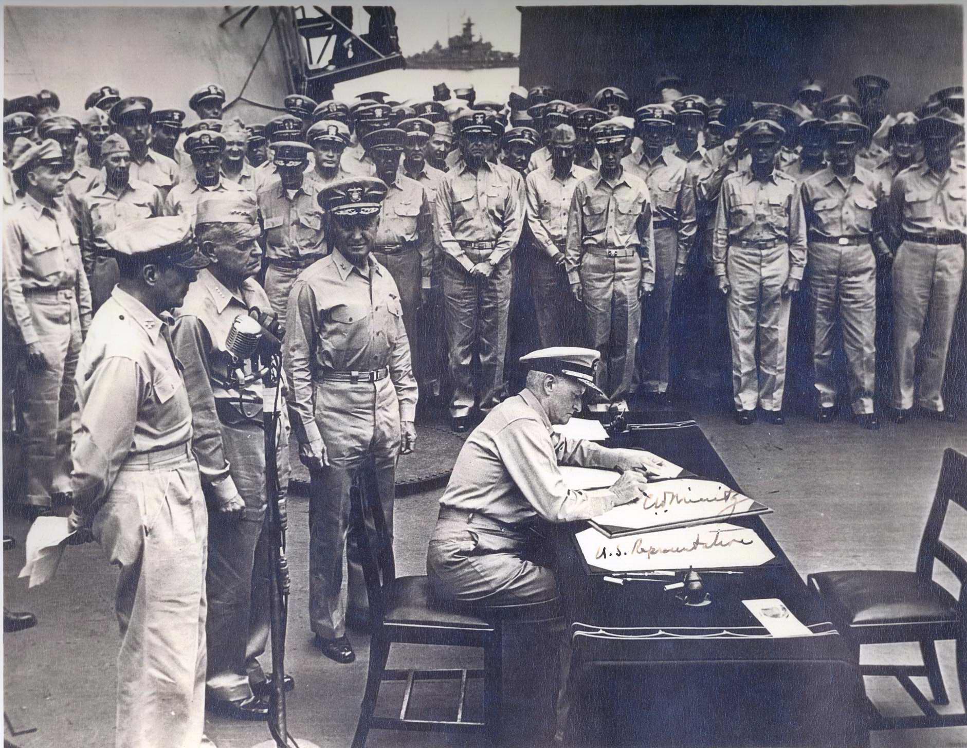 Admiral Nimitz signing terms of Japanese surrender