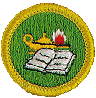 fabric badge with book and lamp of knowledge