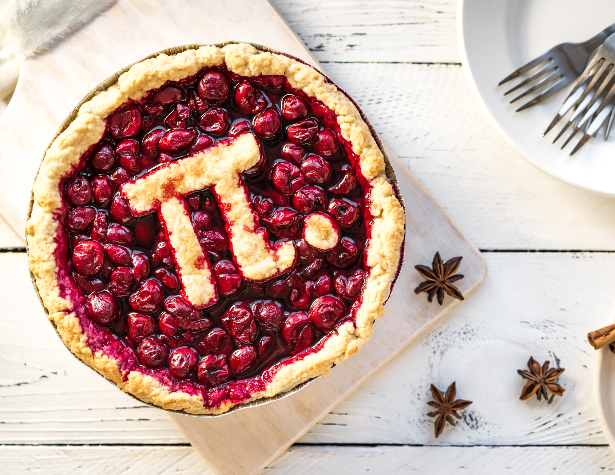 A picture of a cherry pie with the Greek pi symbol on top