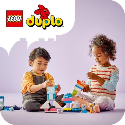 two children playing with duplo blocks