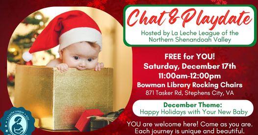 Infant in Santa hat peeking out of a box