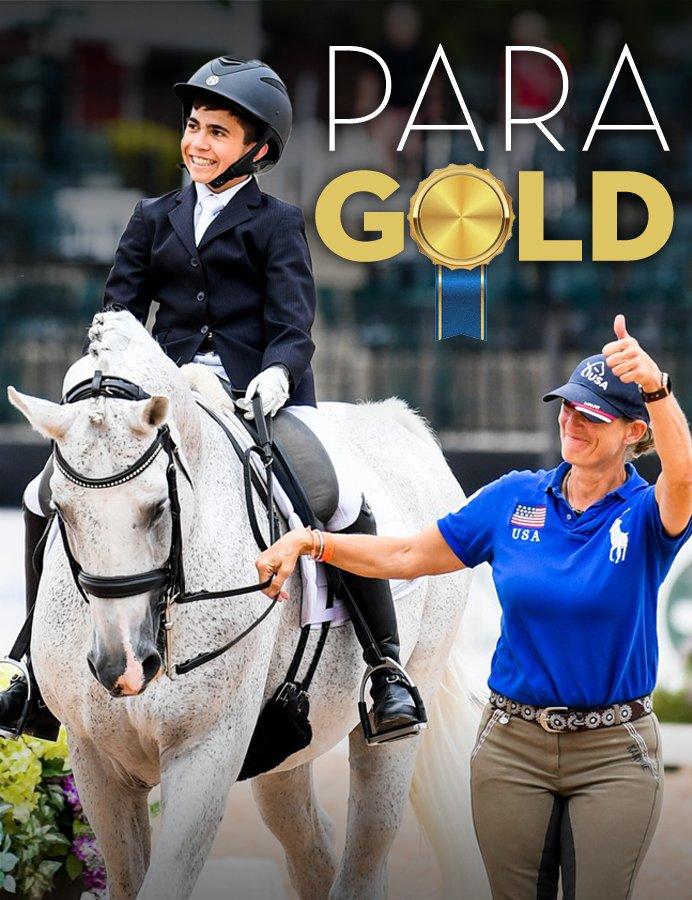 Woman leading horse and rider giving a thumbs up